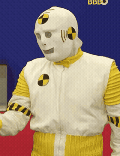 Man In Crash Test Dummy Costume In Front Of Bbbo Sign GIF