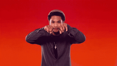 Man In Cross Necklace Pointing GIF