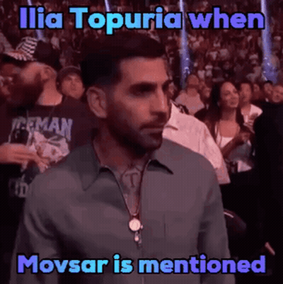 Man In Crowd Watching Boxing Match Saying Ilia Topuria When Movsar Is Mentioned GIF