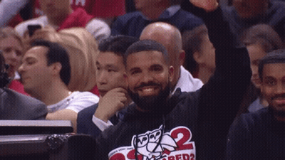 Man In Crowd With '2' Shirt GIF