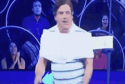 Man In Crowd With Paper On Shirt GIF