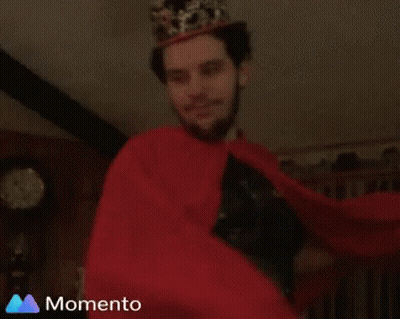Man In Crown And Red Cape Smiling GIF