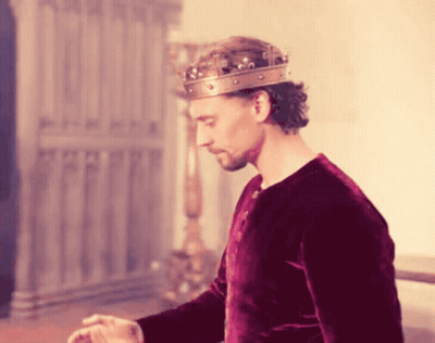 Man In Crown And Red Shirt Standing GIF