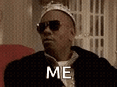 Man In Crown And Sunglasses Saying Me On Couch GIF