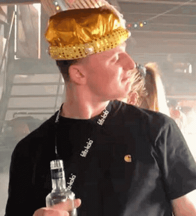 Man In Crown Holding Liquor Bottle GIF