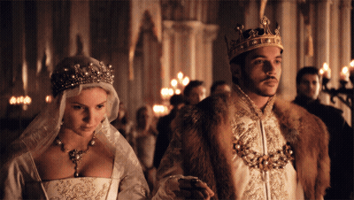 Man In Crown Next To Woman In Wedding Dress GIF