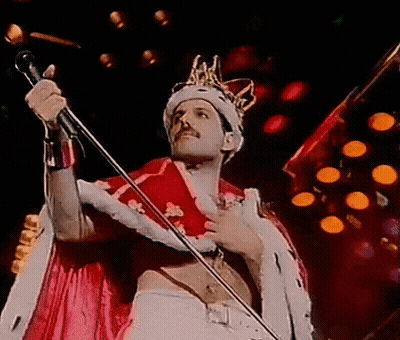 Man In Crown Singing Into Microphone GIF