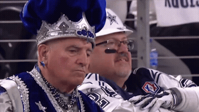 Man In Crown Sitting Next To Man In Cowboy Uniform GIF