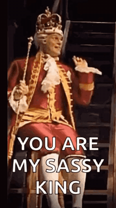 Man In Crown Sitting On Throne Holding Cane And Sword GIF