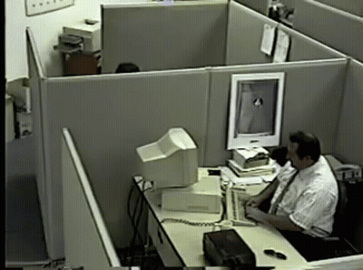Man In Cubicle With Computer Monitor GIF