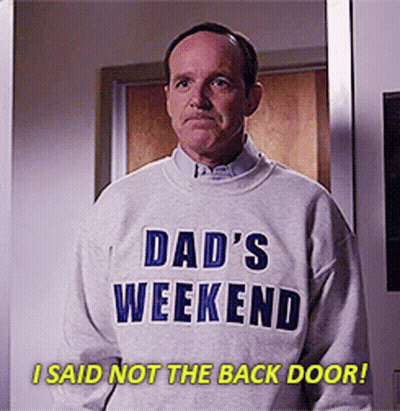 Man In Dad's Weekend Sweater In Front Of Door GIF
