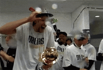 Man In Dallas Shirt Holding Trophy GIF