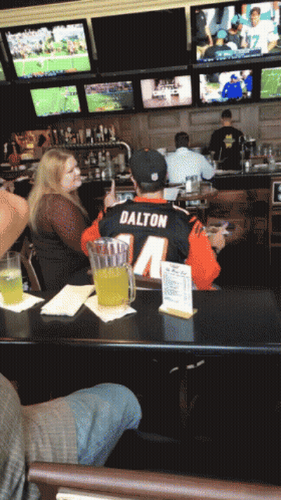 Man In Dalton Jersey Sitting At Table GIF