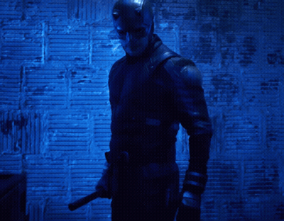 Man In Daredevil Costume Holding Knife GIF