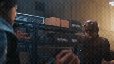Man In Daredevil Costume Talking To Woman GIF