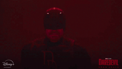 Man in Daredevil Suit Holding Sword