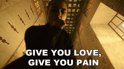Man In Dark Room Saying Give You Love Give You Pain GIF