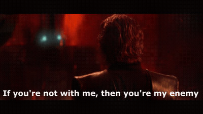 Man In Dark Room Saying If You're Not With Me Then You're My Enemy GIF