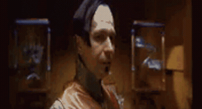Man In Dark Room Saying Lo So GIF