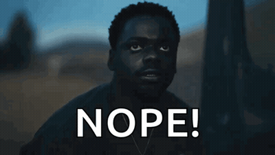 Man In Dark Room Saying Nope GIF
