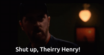Man In Dark Room Saying Shut Up Theirry Henry GIF