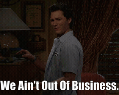 Man In Dark Room Saying We Ain't Out Of Business GIF