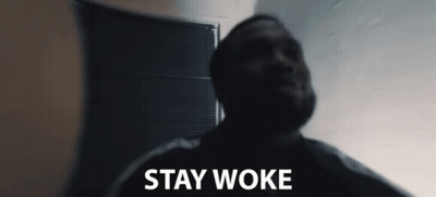 Man In Dark Room Stay Woke GIF