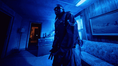 Man In Dark Room With Blue Light GIF