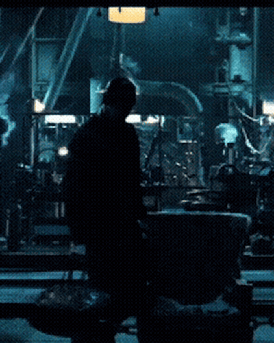 Man In Dark Room With Chain GIF