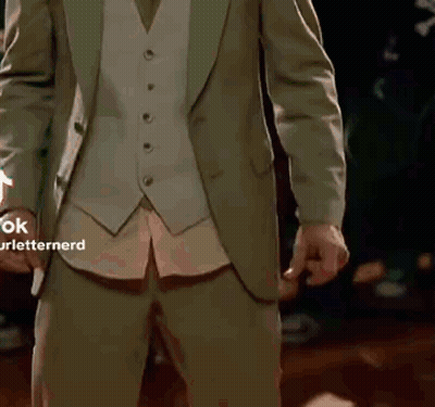 Man In Dark Room With Green Glove GIF