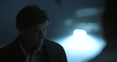 Man In Dark Room With Light On Face GIF