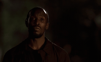 Man In Dark Room With Omar Listenin GIF