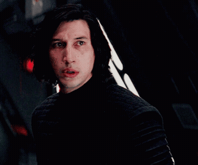 Man In Dark Room With Red Light Behind GIF