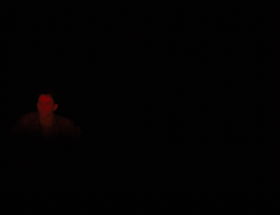 Man In Dark Room With Red Light GIF