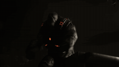 Man In Dark Room With Red Light On Arm GIF