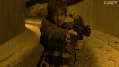 Man In Dark Room With Resident Evil GIF