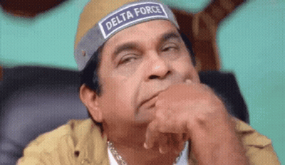 Man In Delta Force Headband Sitting With Hand On Chin GIF