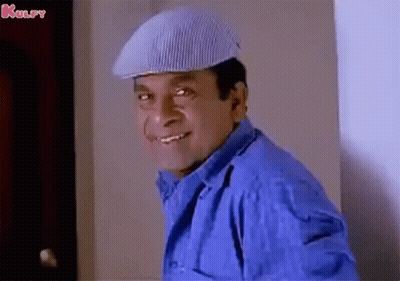 Man In Delta Force Headband Sitting With Hand On Chin GIF