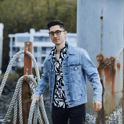 Man In Denim Jacket And Floral Shirt GIF