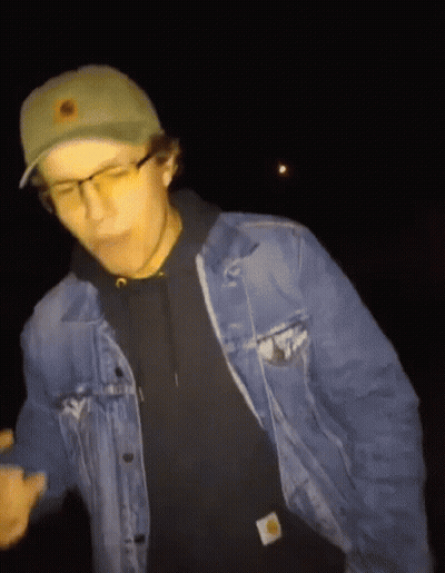 Man In Denim Jacket And Green Hat With Sun GIF