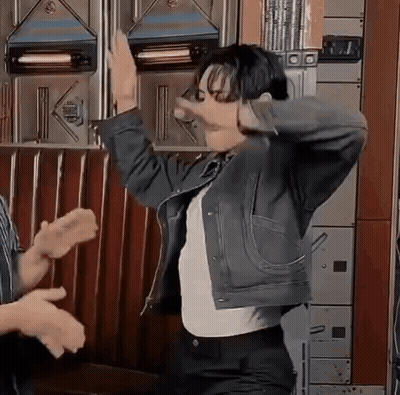 Man In Denim Jacket Dancing With Group GIF