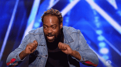 Man In Denim Jacket Dancing With Hands Up GIF