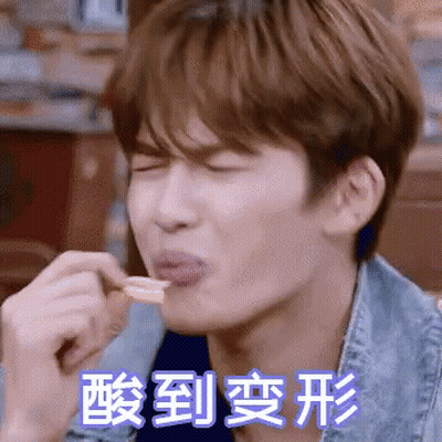 Man In Denim Jacket Eating With Chinese Writing Behind Him GIF