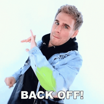 Man In Denim Jacket Pointing Back Off GIF