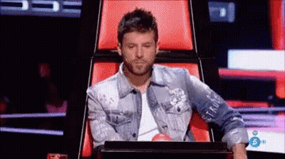 Man In Denim Jacket Sitting With Laptop GIF