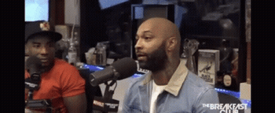 Man In Denim Jacket Talking Into Microphone GIF