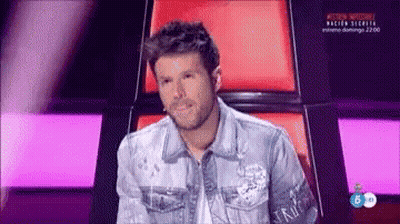 Man In Denim Jacket Using Laptop In Chair GIF