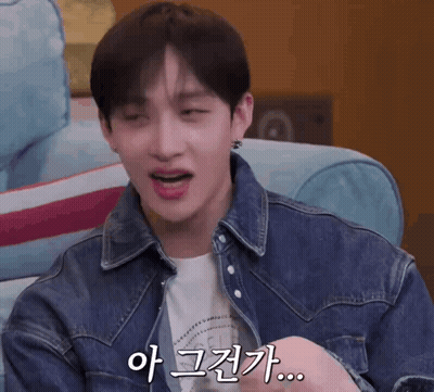 Man In Denim Jacket With Foreign Text On Face GIF