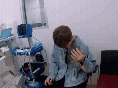 Man In Denim Jacket With Philips Medical Device GIF