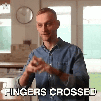 Man In Denim Shirt Crosses Fingers GIF